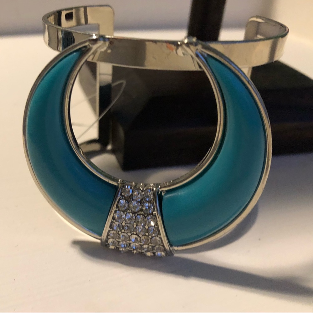 Silver toned cuff bracelet with turquoise design